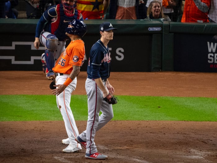 Houston Astros center fielder Jose Siri (26) celebrates as Atlanta Braves starting pitcher Max Fried (54) walks away during the second inning during game two of the 2021 World Series at Minute Maid Park.